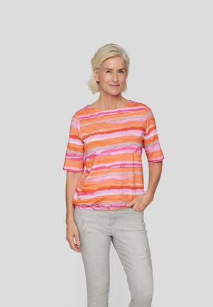 Short-sleeved top featuring wavy orange, pink, and lavender stripes. Made from soft fabric with a relaxed fit and crew neckline.