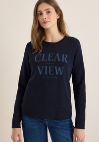 Sweatshirt bleu marine en tissu doux, avec un col rond et des manches longues. Le texte à l'avant en teintes contrastantes indique "CLEAR VIEW".