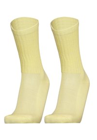 Gelbe, gerippte Knöchelsocken mit einer glatten Textur, ausgestattet mit einer verstärkten Spitze und Ferse für Langlebigkeit und Komfort.
