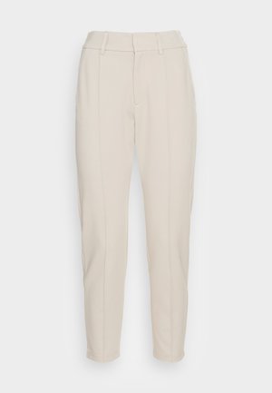 Beige tailored trousers with a high waist, featuring side pockets and stitched detailing on the front. Made from a soft, textured fabric.