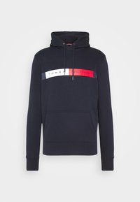 Námornícká modrá mikina s kapucí a přední kapsou ve tvaru klokana, nastavitelné tkaničky na kapuci a logo Tommy Hilfiger v bílé, červené a námořnické modři napříč hrudníkem.