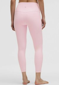 Pink leggings with a high waistband, soft fabric, and a smooth texture. The design features a streamlined fit with no visible patterns or accents.