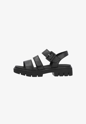 Sandale en cuir noir avec trois lanières, boucle réglable et semelle épaisse à crampons pour une bonne adhérence.
