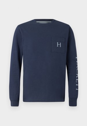 Camisa de manga longa azul-marinho feita de algodão, com um bolso no peito com o logótipo &quot;H&quot; e o texto &quot;HACKETT&quot; impresso na manga esquerda.
