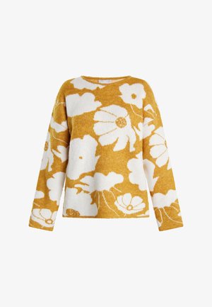 Dzeltena sinepju krēklveste ar baltām ziedu rakstām, garām piedurknēm, apaļu kakla izgriezumu un mīkstu, teksturētu apdari.