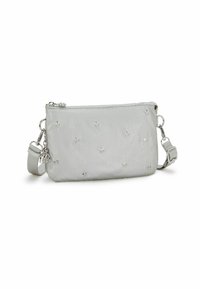 Grey fabric crossbody bag with star embellishments, zip closure, and adjustable strap. Features silver hardware and a decorative charm.