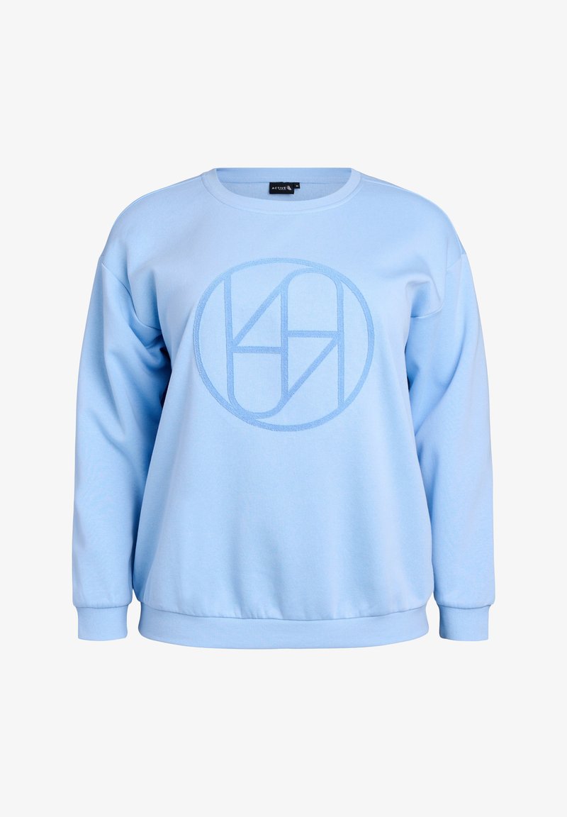 Ljusblå sweatshirt med långärmar, rund halsringning och ribbad ärm. Har en texturerad cirkulär logga i en något mörkare blå nyans.