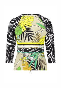 Langermige top met een gemengd patroon van zwart-witte strepen en gele en groene tropische bladeren op een beige achtergrond. Decoratieve ringdetail.