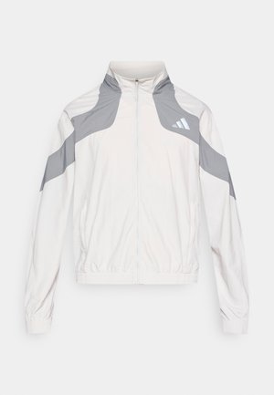Lichtgewicht jack met ritssluiting in off-white met grijze accenten, voorzien van een hoge kraag, elastische manchetten en een sportief ontwerp met een drie strepen-logo.