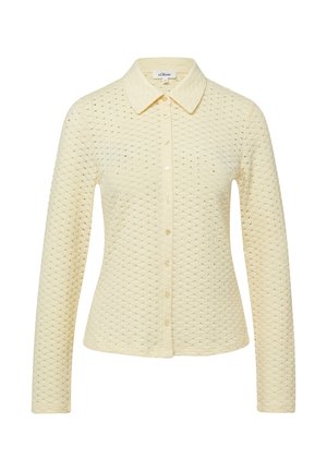 Crèmekleurige lange mouw cardigan met knoopsluiting, voorzien van een getextureerd gestippeld patroon en een klassieke kraag, met een getailleerde pasvorm.