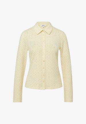 Crèmekleurige lange mouw cardigan met knoopsluiting, voorzien van een getextureerd gestippeld patroon en een klassieke kraag, met een getailleerde pasvorm.
