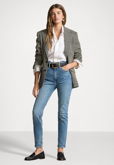Gray houndstooth blazer, white button-up shirt, light blue high-waisted jeans, black belt, and black loafers.