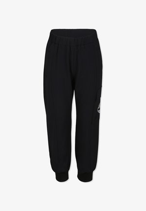 Pantaloni jogger neri realizzati in un tessuto morbido, con vita elasticizzata, polsini affusolati, tasche laterali e un dettaglio con logo sulla gamba.