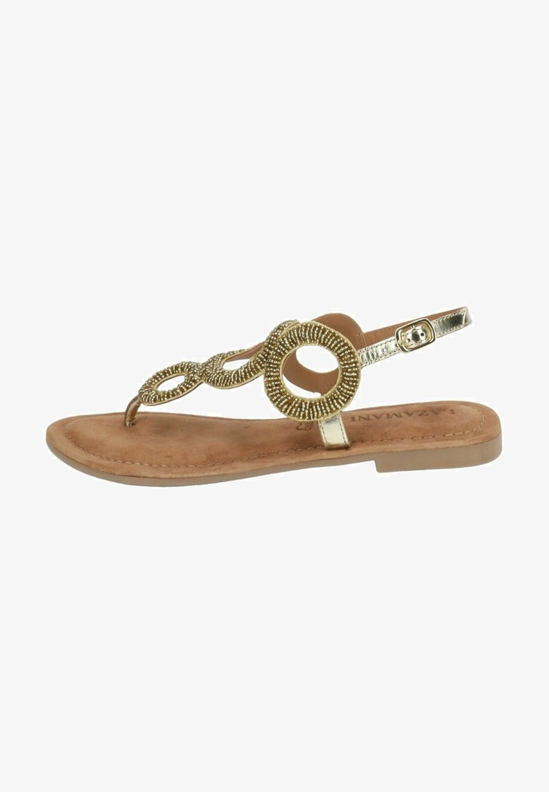 Sandali piatti dorati con un design decorativo di perline e accenti circolari. Cinturino alla caviglia regolabile e una soletta marrone testurizzata.