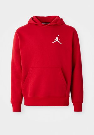Rode katoenen hoodie met een voorzak, geribbelde manchetten en een witte Jordan-logo op de linkerborst. Zachte textuur en casual ontwerp.
