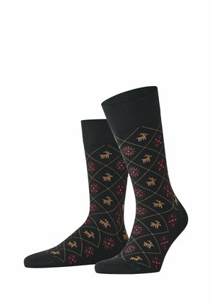 Schwarze Kurzsocken mit einem Muster aus beigen Hunden und roten Sternformen, die in Diamantumrissen angeordnet sind.