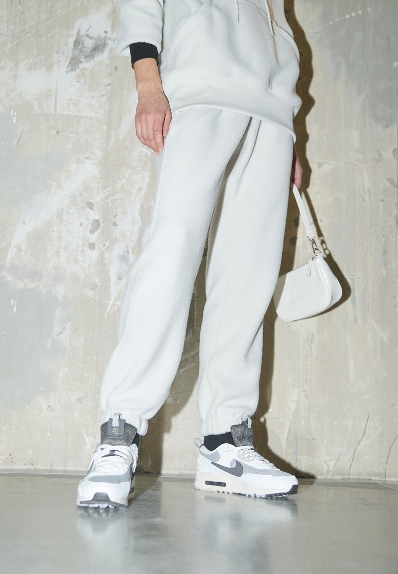 Nike Sportswear - Tracksuit bottoms - light bone/light iron ore, Enlarge