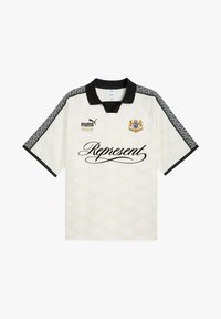 Camicia bianca a maniche corte con colletto nero, maniche decorate, stemma dorato e la scritta "Represent" in corsivo sul davanti.