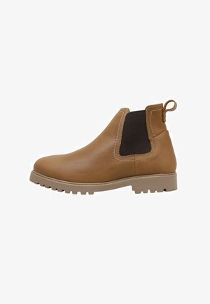 Botte Chelsea en cuir fauve avec panneau latéral élastique noir, languette de traction au talon et semelle crantée beige.