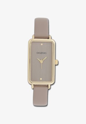 Montre rectangulaire en or avec un cadran gris brossé, mouvement à trois aiguilles et un bracelet en cuir gris clair. Présente un design minimaliste et un logo.