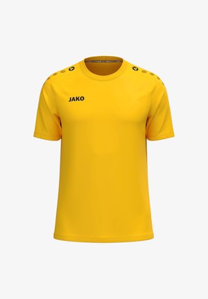 T-shirt de sport jaune à manches courtes avec logo JAKO noir sur la poitrine et motif de cercles sur les épaules.