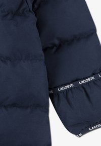 Lacoste SOLID PRAM - Combinaison de ski - marine