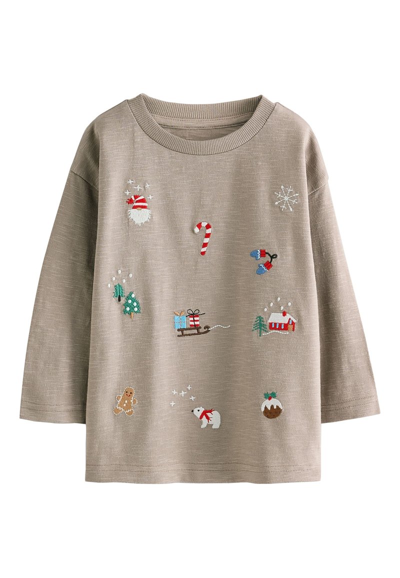 Sweat-shirt beige clair avec plusieurs broderies colorées sur le thème de Noël, incluant le Père Noël, un bâton de sucre d'orge, et des animaux d'hiver.