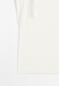 White t-shirt made of soft, smooth fabric. Features short sleeves and a rounded neckline, with no visible patterns or graphics.