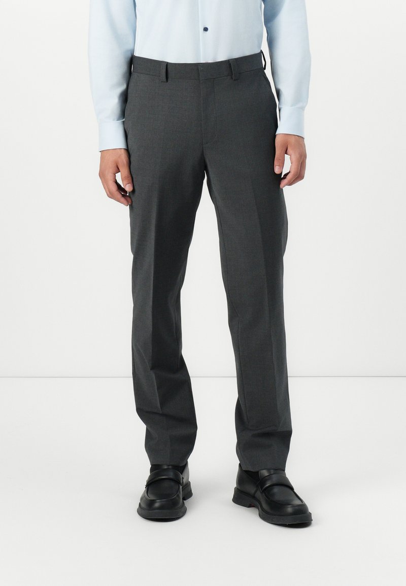 Gray tailored trousers with a smooth texture, featuring a flat front and belt loops, paired with black loafers.