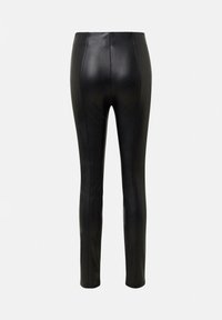 Schwarze Lederleggings mit einem figurbetonten Design, vertikalen Nähten und einer glatten Textur. Knöchellang mit hoher Taille.