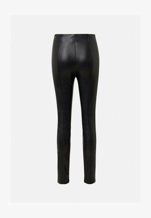 Schwarze Lederleggings mit einem figurbetonten Design, vertikalen Nähten und einer glatten Textur. Knöchellang mit hoher Taille.