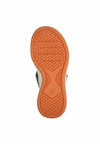 Shoe outsole with a textured bottom in orange rubber, featuring a geometric pattern for grip, bordered by a white side edge.