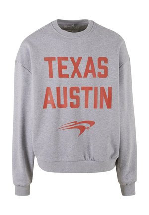 Gray sweatshirt featuring large red text reading "TEXAS AUSTIN" on the front. Ribbed cuffs and hem, soft fabric with a crew neck design.