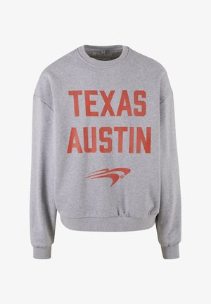 Szürke kapucnis pulóver, nagy piros betűkkel "TEXAS AUSTIN" felirattal az elején. Bordás mandzsetták és alj, puha anyag, kerek nyakkivágással.