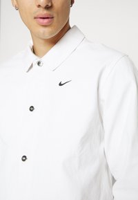 Nike Sportswear CHORE COAT - Chaqueta fina - phantom/black