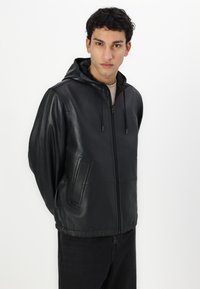 COACH REVERSIBLE TRAINER - Kožnata jakna - black/charcoal