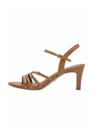 Braune Sandalen mit Absatz, die mehrere dünne Riemen, kreisförmige Details und eine glatte Lederstruktur mit moderater Absatzhöhe aufweisen.