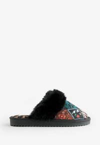 Faux fur-lined slide slipper featuring a colorful patterned upper, black outsole, and a flat design with textured rubber for grip.