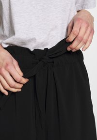 mbyM Tygbyxor - black