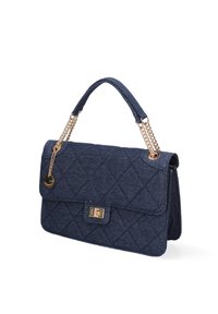 Denim handbag with a quilted pattern, dark blue color, gold chain straps, and a rectangular clasp. Features a detachable charm.
