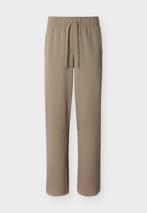 Pantaloni sportivi beige a gamba dritta con vita elasticizzata e coulisse, caratterizzati da un sottile testo del logo verticale sull'anca destra.