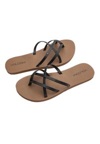 Sorte flip-flops med stropper og en tan gummisål, der har to krydsede stropper og et præget "VOLCOM"-logo på indersålen.