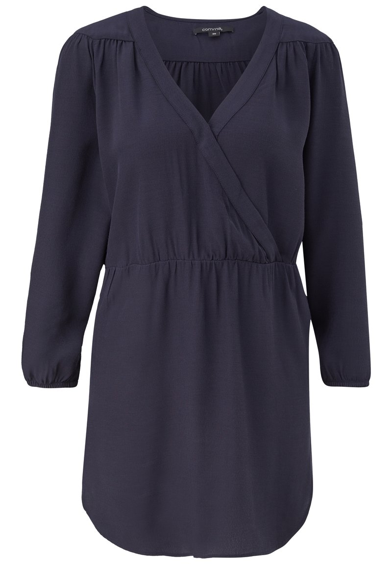 Mörkblå omslagklänning i lätt tyg, med djup V-ringning, långa puffärmar och resårmidja för en bekväm passform.