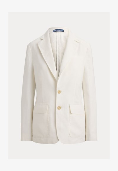 Μπεζ σακάκι με δύο κουμπιά, λοξές πέτρες, δύο εμπρόσθιες τσέπες με καπάκι και εσωτερική ετικέτα Polo by Ralph Lauren στον γιακά.