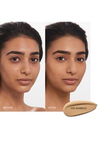Two side-by-side portraits showing skin improvement; left shows natural skin tone, right with a smooth, even finish. Below, a swatch of foundation labeled "330 BAMBOO."