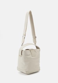 Tommy Jeans STARTDUST BUCKET BAG - Kabelka - offwhite