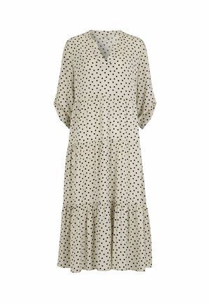 Beżowa sukienka midi w czarne grochy, z dekoltem w serek, rękawami do ćwiartki oraz warstwową, marszczoną spódnicą.