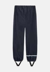 Veekindlad tumesinised püksid elastse piha, kitsenevate jalgade, reguleeritavate pahkluu rihmade ja peegeldava valge triibuga allääres.