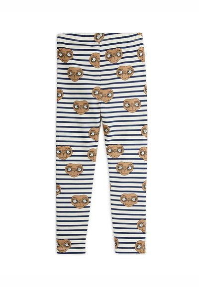 Rugalmas pamutból készült leggings kék és fehér csíkos mintával, amely ismételt barna és bézs színű mesealien arcképeket tartalmaz.