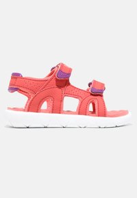 Rosa syntetisk sandal med vit gummisula. Har två justerbara remmar med lila detaljer och utskärningar för ventilation.